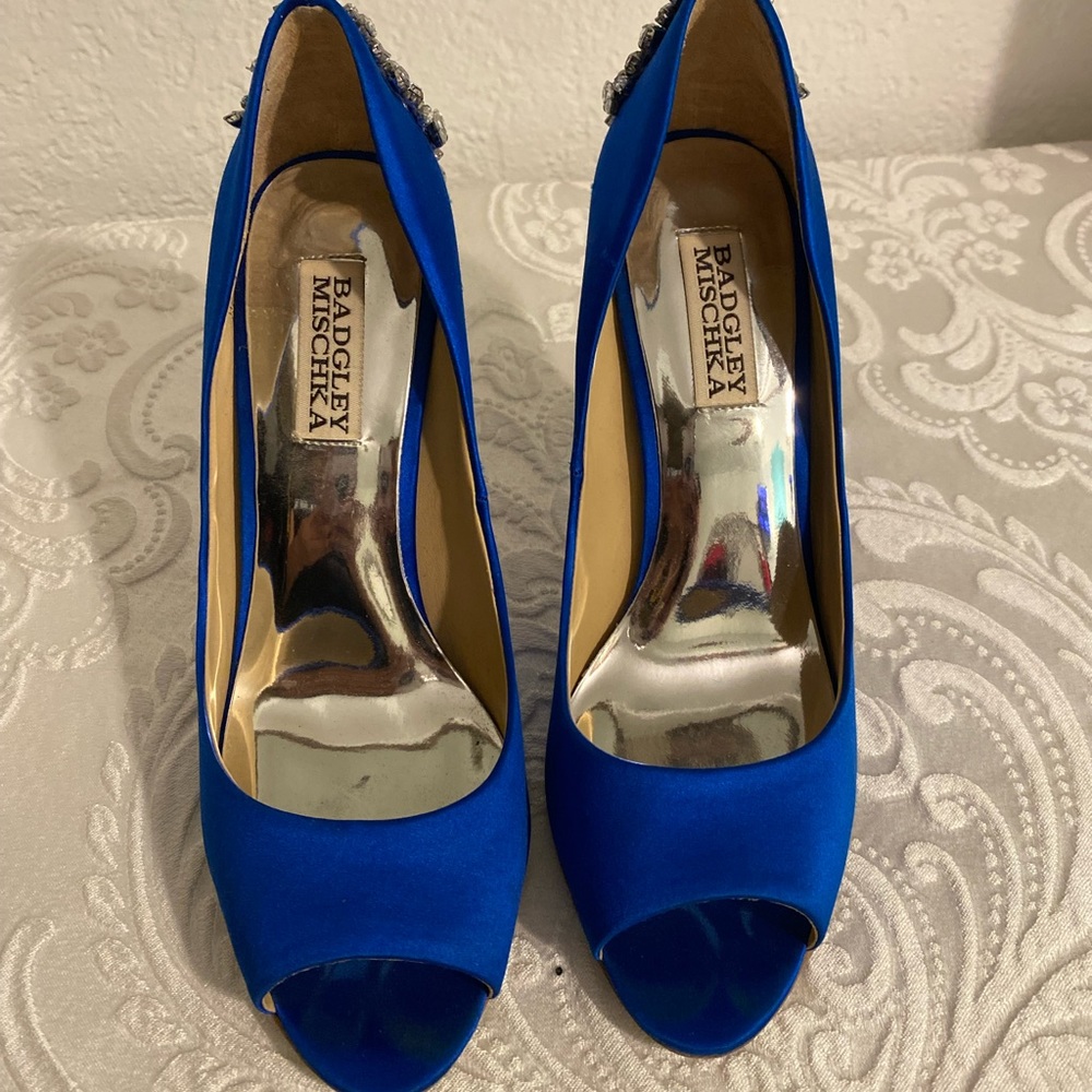 Size 7 total blue satin high heels. Worn only a few times. excellent condition